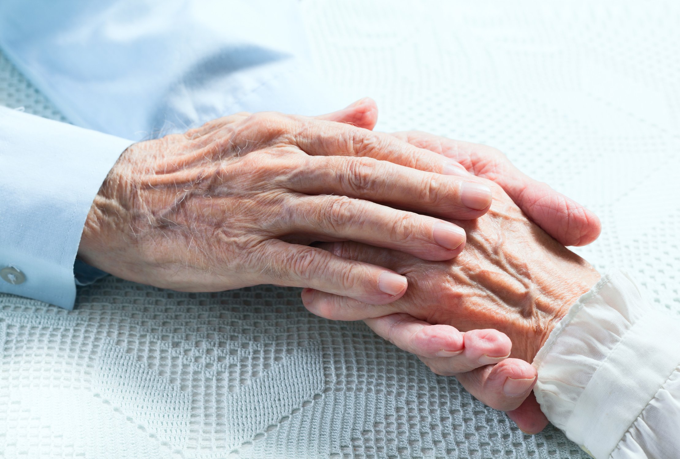 Old People Holding Hands. Closeup.